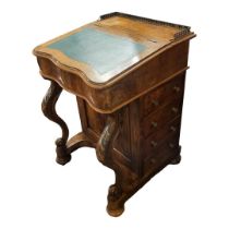 A VICTORIAN FIGURED WALNUT DAVENPORT DESK With brass gallery above a faux green leather rise and