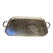 A LARGE VINTAGE SILVER PLATED BUTLER'S TRAY Twin handles and scrolled edge, marked ‘M and Co. EPNS’.