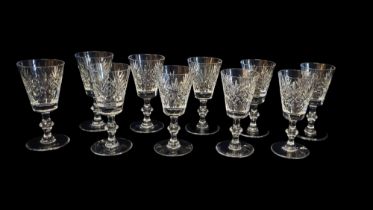 A SET OF TEN CUT LEAD CRYSTAL SHERRY GLASSES Having a bell form bowl and knop to stem. (approx 13.