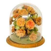 A VICTORIAN GLASS AND OAK DISPLAY DOME Containing a faux flower arrangement with butterfly. (