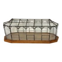 A MODERN MODEL OF ORANGERIE PLANTS GREENHOUSE GLASS COVERED ON SOLID OAK RECTANGULAR BASE. (h 59cm x