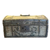 AN 18TH CENTURY HIDE AND STUDDED CASKET With domed top and iron carrying handle. (41cm x 26cm x