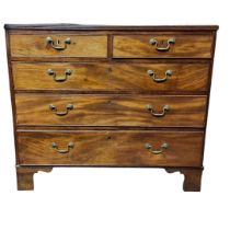 A GEORGIAN MAHOGANY CHEST Two short above three long drawers with brass swan neck handles, on