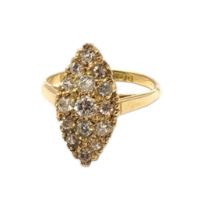A VINTAGE 18CT GOLD AND DIAMOND CLUSTER RING Having an arrangement of round cut stones forming a