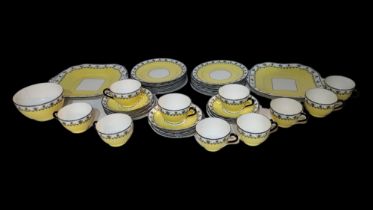 AYNSLEY, AN EARLY 20TH CENTURY PORCELAIN TEA SERVICE Having a black handle and border on yellow