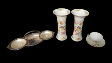 A PAIR OF CONTINENTAL HARD PASTE TRUMPET SHAPED PORCELAIN VASES Decorated to one side with exotic