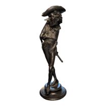 A 19TH CENTURY FRENCH SPELTER FIGURAL CANDLESTICK OF CYRANO DE BERGERAC A comical caricature in