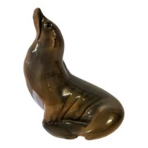 ROYAL COPENHAGEN, A LARGE HARD PASTE PORCELAIN MODEL OF A SEAL, CIRCA 1955 Covered with naturalistic