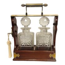BETJEMANN, A 19TH CENTURY MAHOGANY,BRASS AND CUT LEAD CRYSTAL TANTALUS Two square decanters with cut