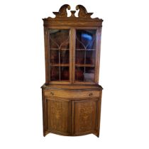 AN EDWARDIAN MAHOGANY AND FLORAL MARQUETRY INLAID BOOKCASE CABINET With two gothic glazed doors