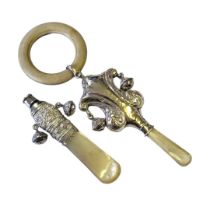 AN EDWARDIAN SILVER AND MOTHER OF PEARL CHILD'S RATTLE Having a whistle finial, twin bells and