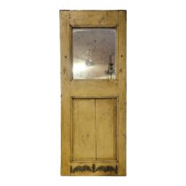 A 19TH CENTURY FRENCH PAINTED PINE DOOR With partial mirrored section above fielded panel. (69cm x