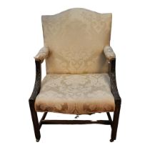 AN 18TH CENTURY MAHOGANY OPEN ARMCHAIR With acanthus carved show wood arms, later floral cream