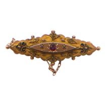 AN EDWARDIAN 9CT GOLD, AMETHYST AND DIAMOND BROOCH The central round cut amethyst flanked by two