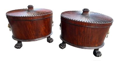 A GOOD PAIR OF GEORGE III OVAL MAHOGANY CELLARETTE With gadrooned carved top fitted with lion mask