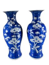 PAIR OF 19TH CENTURY CHINESE QING DYNASTY BLUE AND WHITE VASES Decorated with prunus blossom on blue