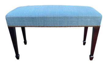 A 19TH CENTURY MAHOGANY BOW FRONTED UPHOLSTERED WINDOW SEAT Raised on four square tapering legs. (