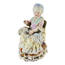 MEISSEN, AN 18TH CENTURY GERMAN PORCELAIN FIGURE, TITLED ‘GIRL WITH YARN’, MODELLED BY MICHEL VICTOR