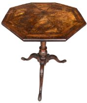 A GEORGE II CARVED WALNUT TRIPOD TABLE The octagonal top inlaid with burr wood supported on a carved