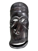 MAKONDE, TANZANIA, A LARGE EARLY TO MID-20TH CENTURY CARVED WOOD TRIBAL MASK. (h 47cm x w 21.5cm x d