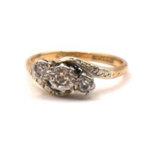 A 9CT GOLD AND PLATINUM, DIAMOND CROSSOVER RING Old European cut diamonds (largest approx diameter