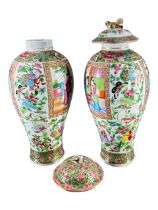 TWO EARLY 19TH CENTURY CHINESE CANTON FAMILLE ROSE VASES Decorated with multiples panels showing