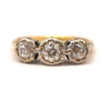AN 18CT GOLD AND PLATINUM THREE STONE DIAMOND RING The central round old European cut diamond (