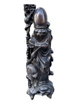 A LARGE CHINESE LATE QING DYNASTY CARVED HARDWOOD FIGURE OF SHOUXING, ONE OF THE EIGHT IMMORTALS. (h