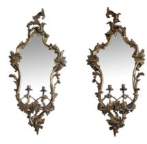 A PAIR OF 19TH CENTURY GEORGE III DESIGN CARVED GILTWOOD GIRONDELL MIRRORS The cartouche frames