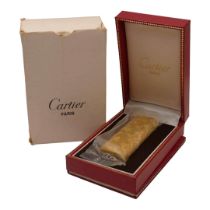 CARTIER, A VINTAGE GOLD PLATED LIGHTER, UNOPENED CELLOPHANE Housed in a box, complete with