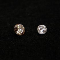 TWO LOOSE UNMOUNTED ROUND BRILLIANT CUT DIAMONDS, BOXED. (0.08ct/0.16ct)