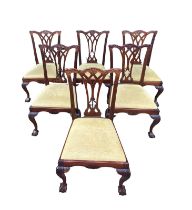 A SET OF SIX GEORGE III DESIGN CARVED MAHOGANY DINING CHAIRS The priced backs above drop in