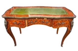 A LOUIS XV DESIGN GILT METAL MOUNTED KINGWOOD WRITING TABLE The green tooled leather top above three