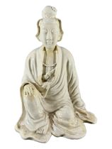 17TH CENTURY, POSSIBLY EARLIER CHINESE DEHUA BLANC DE CHINE SEATED FIGURE OF GUANYIN Showing right