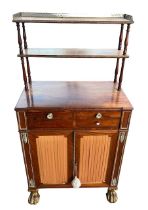 A 19TH CENTURY REGENCY ROSEWOOD AND BRASS MOUNTED SECRETAIRE CHIFFONIER With two shelves above a