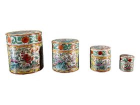 COLLECTION OF FOUR 19TH CENTURY CHINESE FAMILLE JAUNE CYLINDRICAL JARS AND COVERS Each decorated