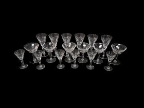 A SET OF SIX WATERFORD LEAD CRYSTAL CUT CHAMPAGNE GLASSES With bell trumpet bowl, cut panel body, on