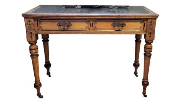 IN THE MANNER OF HEALS, A VICTORIAN AESTHETIC MOVEMENT ASH WRITING TABLE Having a gilt tooled
