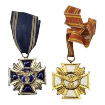 TWO WWII GERMAN NSDAP LONG SERVICE MEDALS White metal with blue enamel and gilt metal with white