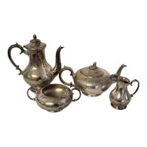 AN EARLY 20TH CENTURY SILVER PLATED FOUR PIECE TEA SET Comprising a coffee pot, teapot, sugar