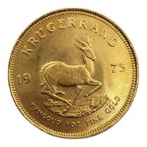 A 22CT GOLD FULL 1OZ KRUGERRAND COIN, DATED 1975 With portrait bust and springbok design to reverse,