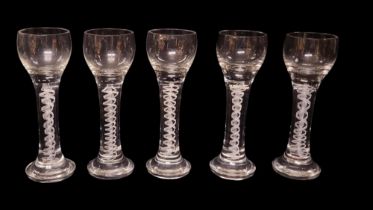 A SET OF FIVE LARGE 20TH CENTURY AIR TWIST LEAD CRYSTAL GLASSES Having white glass twist to stem. (