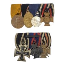 TWO WWI GERMAN MEDAL GROUPS To include a trio of medals 1914 iron cross, Duchy of Oldenburg