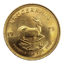 A 22CT GOLD FULL 1OZ KRUGERRAND COIN, DATED 1975 With portrait bust and springbok design to reverse,