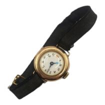 AN EARLY 20TH CENTURY 9CT GOLD LADIES’ WRISTWATCH Having red twelve and fabric strap. (approx 2.5cm)