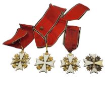 A COLLECTION OF THREE WWII GERMAN EAGLE STAR MEDALS White metal with enamel on red, black and