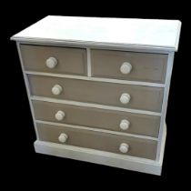 A CREAM AND MUSHROOM PAINTED CHEST Having an arrangement of two above three long drawers. Condition: