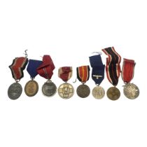 A COLLECTION OF WWII GERMAN MEDALS To include West Wall medal ,social welfare medal.