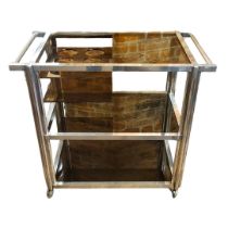 A STYLISH VINTAGE ALUMINIUM AND SMOKED GLASS THREE TIER DRINKS SERVING TROLLEY With six bottle tray,