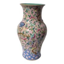 A LATE QING DYNASTY CHINESE FAMILLE ROSE PORCELAIN BALUSTER VASE, CIRCA 1900 Flora pattern, body